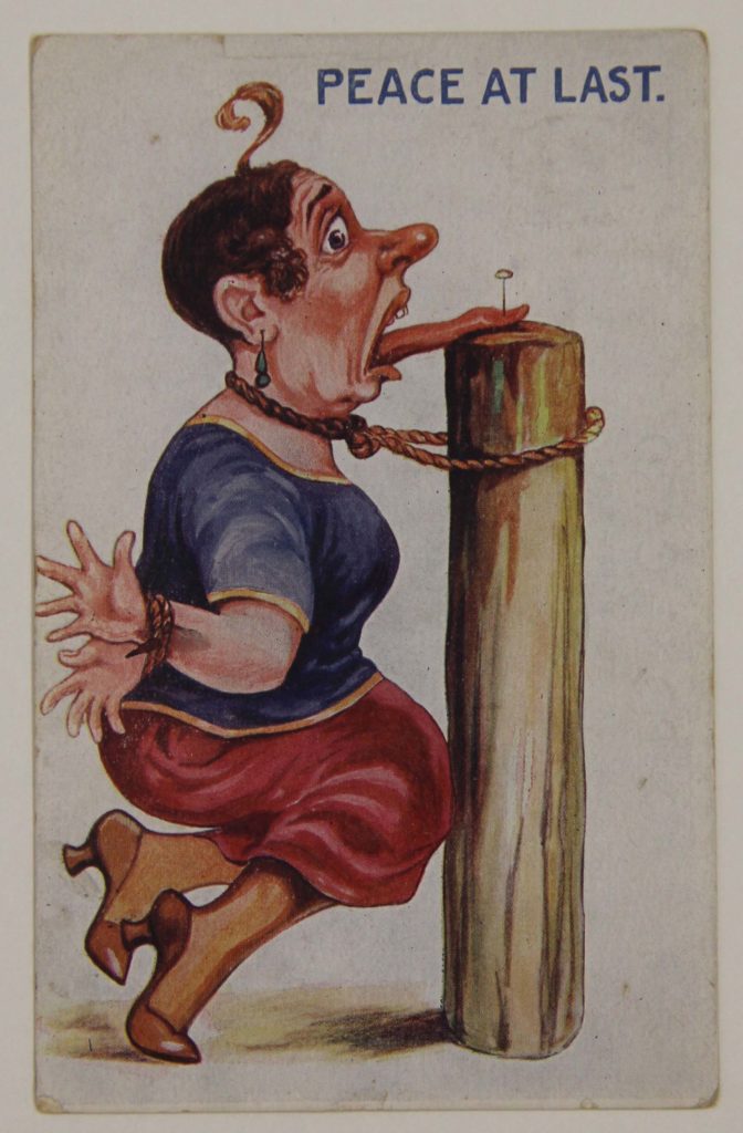 an anti suffragette postcard depicting a bound woman with her tongue nailed to a post