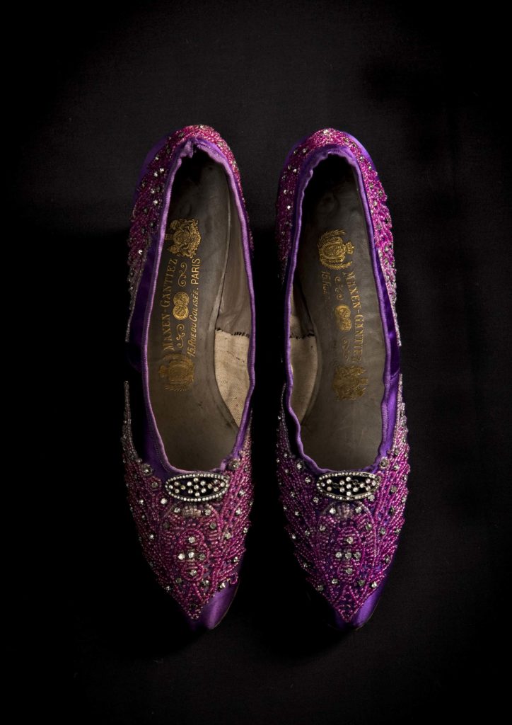 a photo of a purple silk pair of court shoes